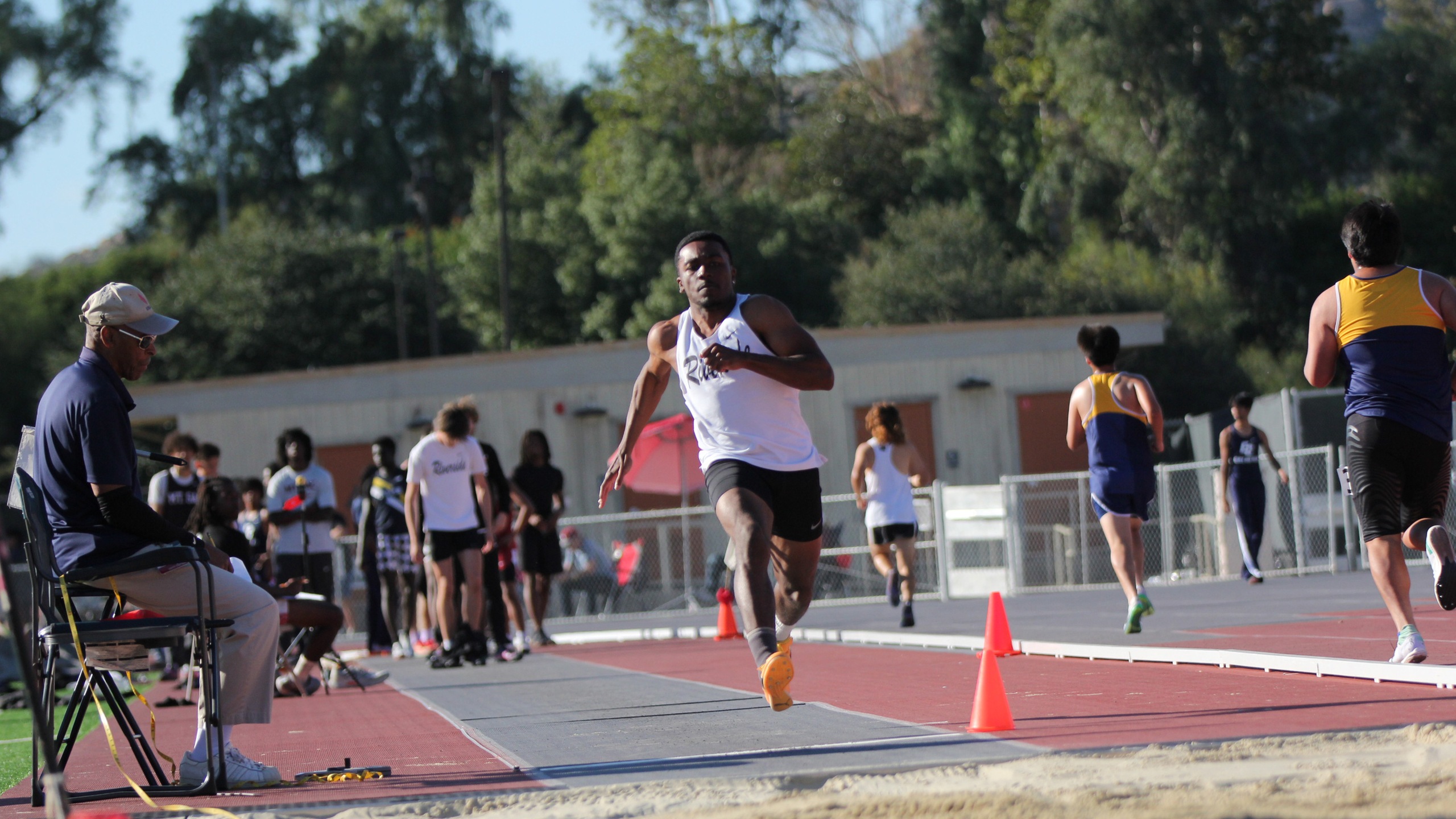 Riverside athlete jumps at track meet