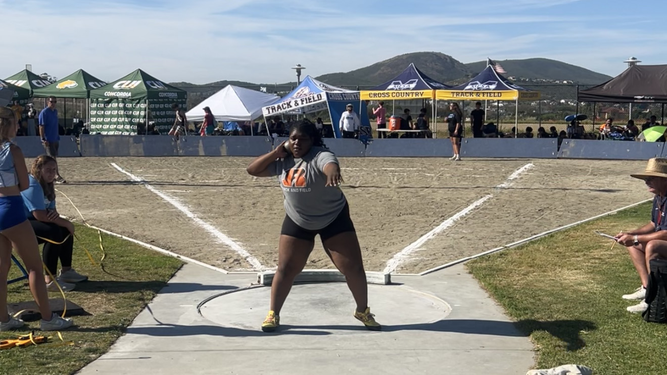 Nyah Brown wins the shot put event
